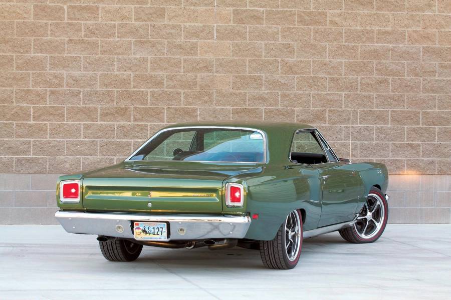 Attached picture rear-3-4-of-a-1969-plymouth-road-runner-color-parked-in-front-of-a-wall.jpg