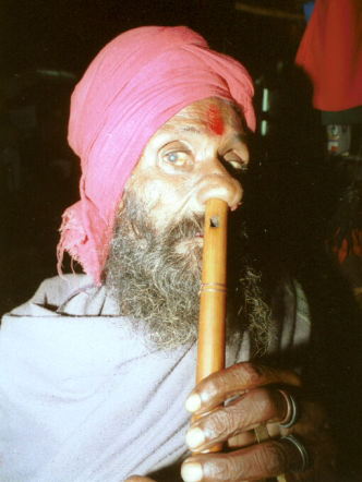 Attached picture 6648117-Nose_flute_player.jpg